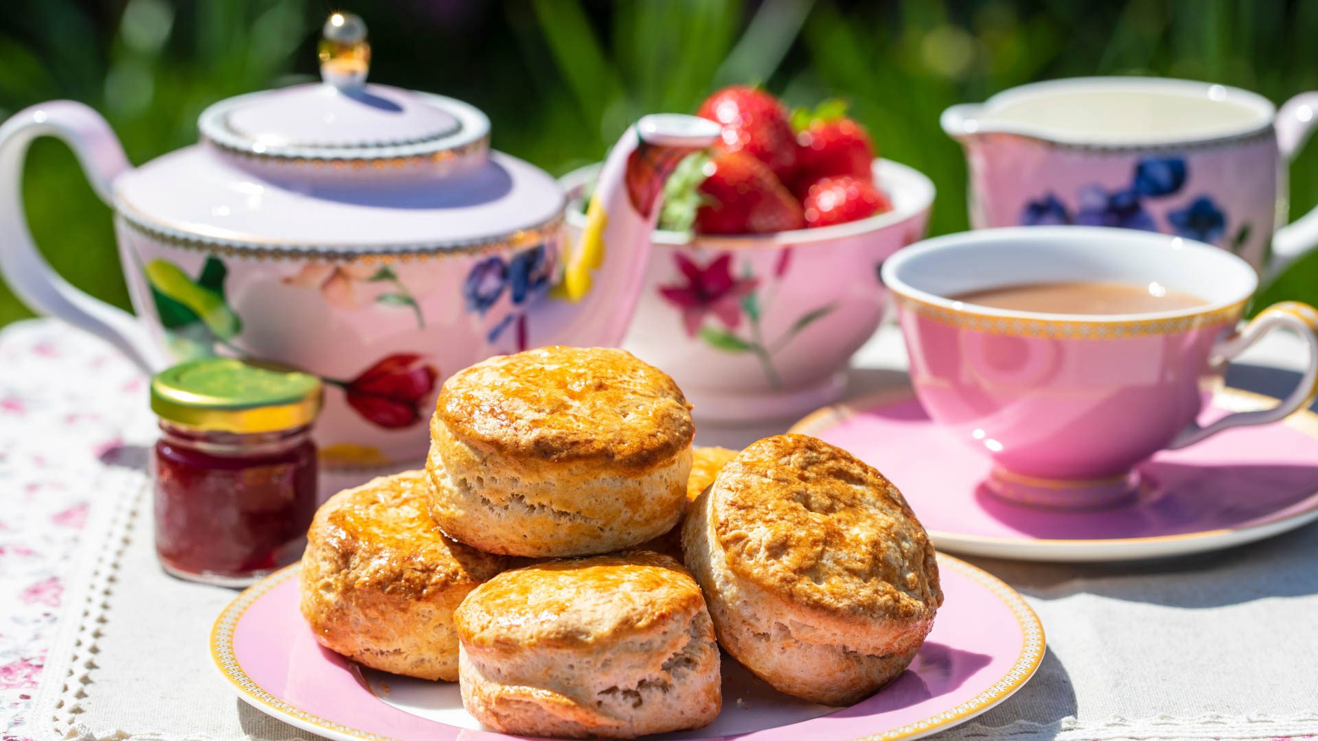 A traditional afternoon tea in Britain with a pot of tea and scones