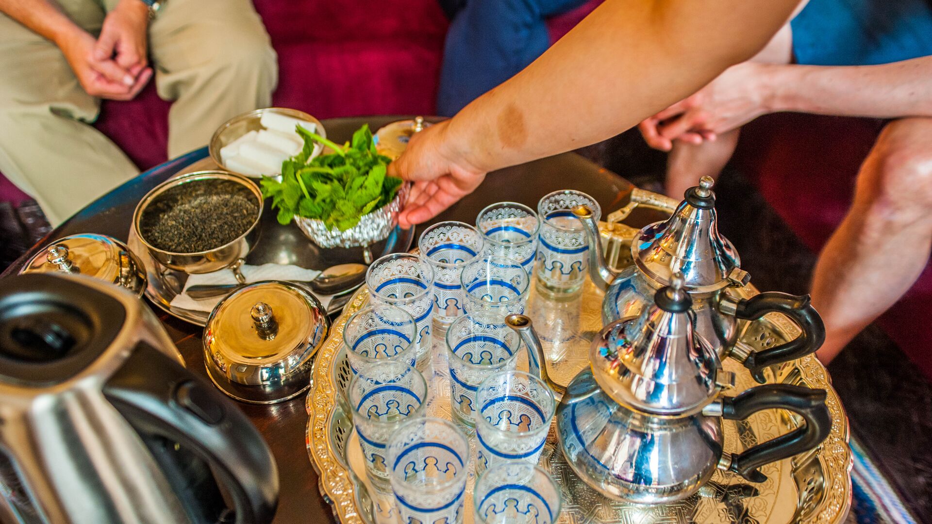 A tray of traditional Moroccan mint tea and glass cups