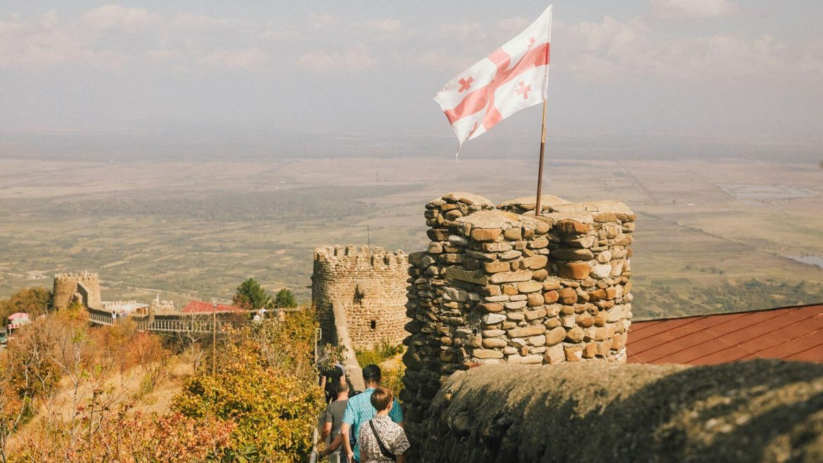 A traditional watch tower flying the Georgia flag, Sighnaghi, Georgia