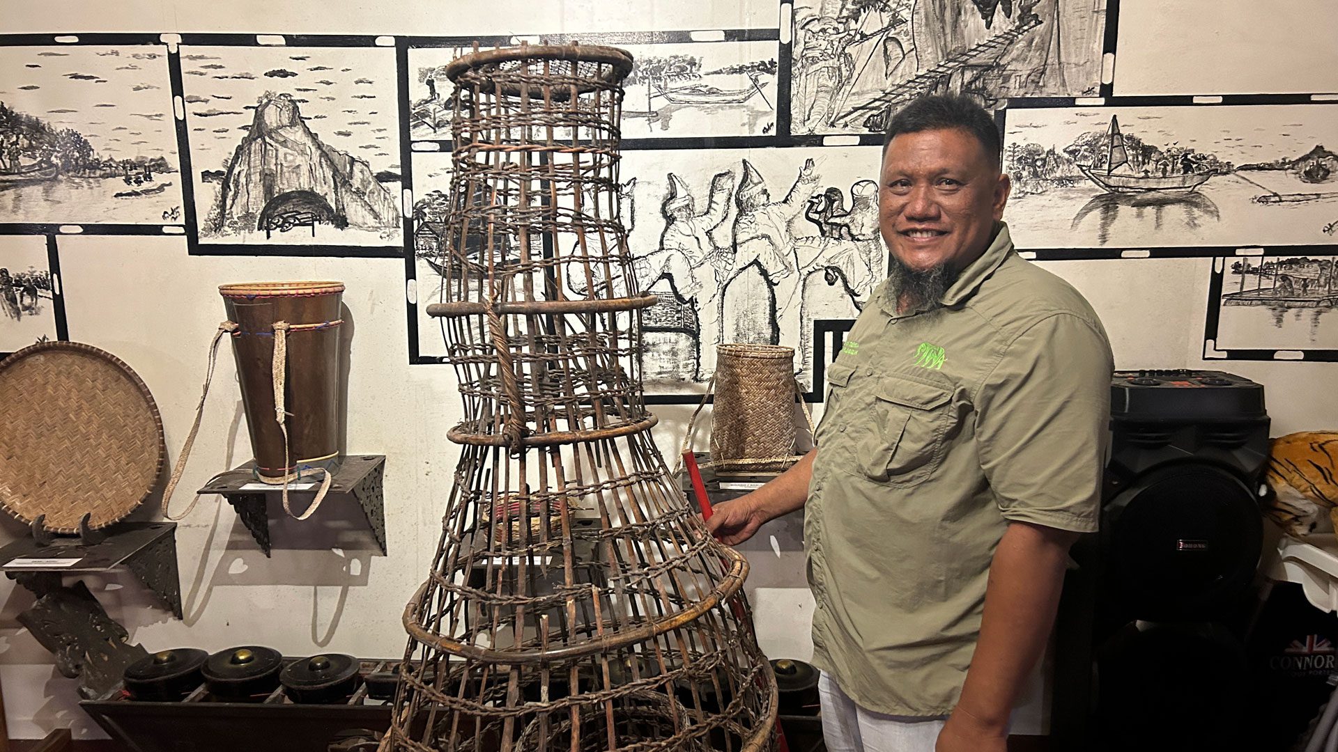 Nelson demonstrating a bubu fishing trap in Borneo