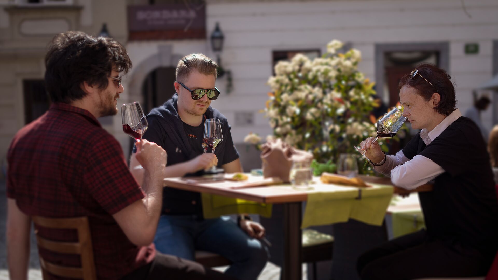 Locals in Slovenia sampling the country's wine.