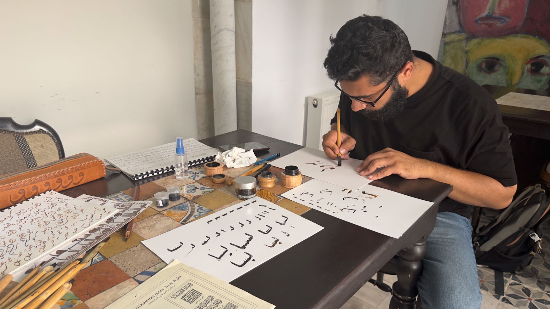 Learn calligraphy with a local artist in Tunisia with Intrepid.