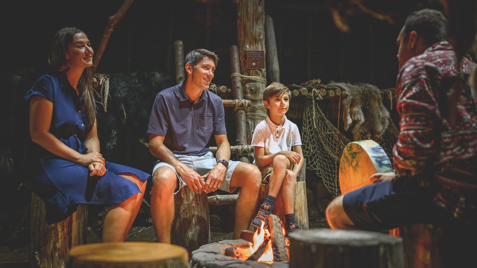 A family experience Iroquoian traditions and storytelling at Huron-Wendat Museum in Quebec.