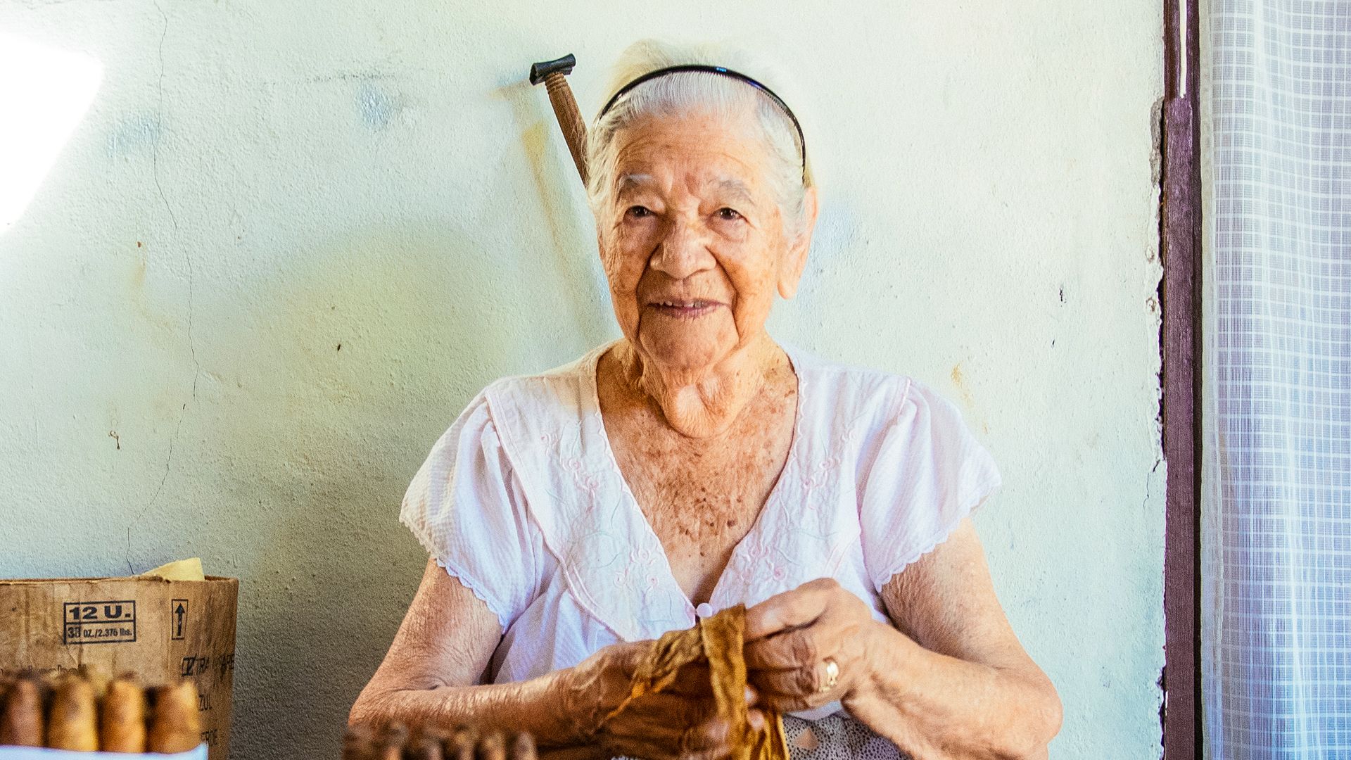 A local cigar roller in El Salvador.