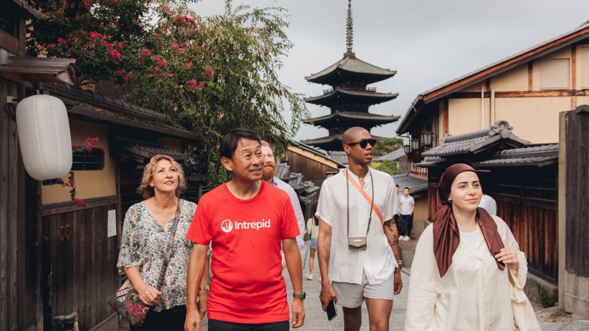 Intrepid leader and travellers walking the streets of Kyoto