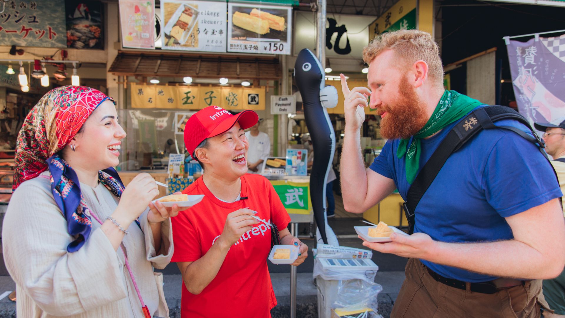 Intrepid travellers at a food market in Tokyo, Japan.