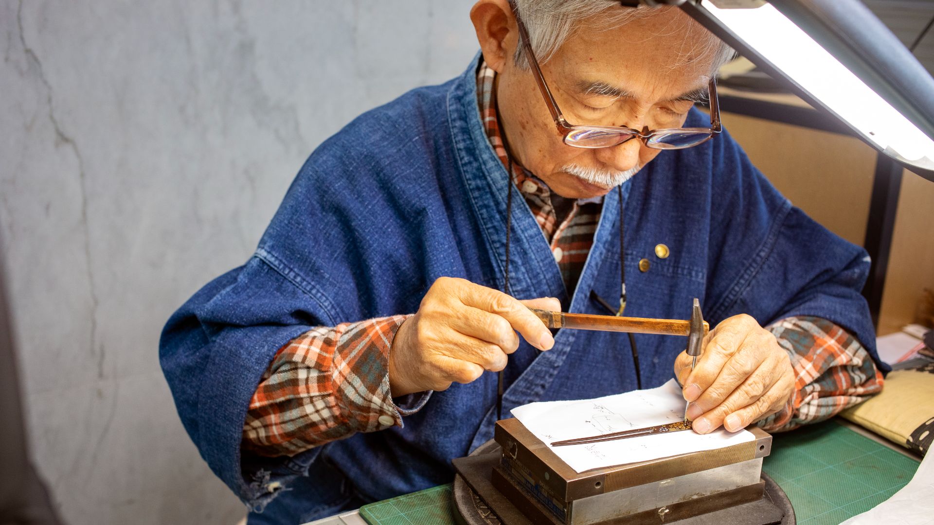 A Japanese man practicing his craft.