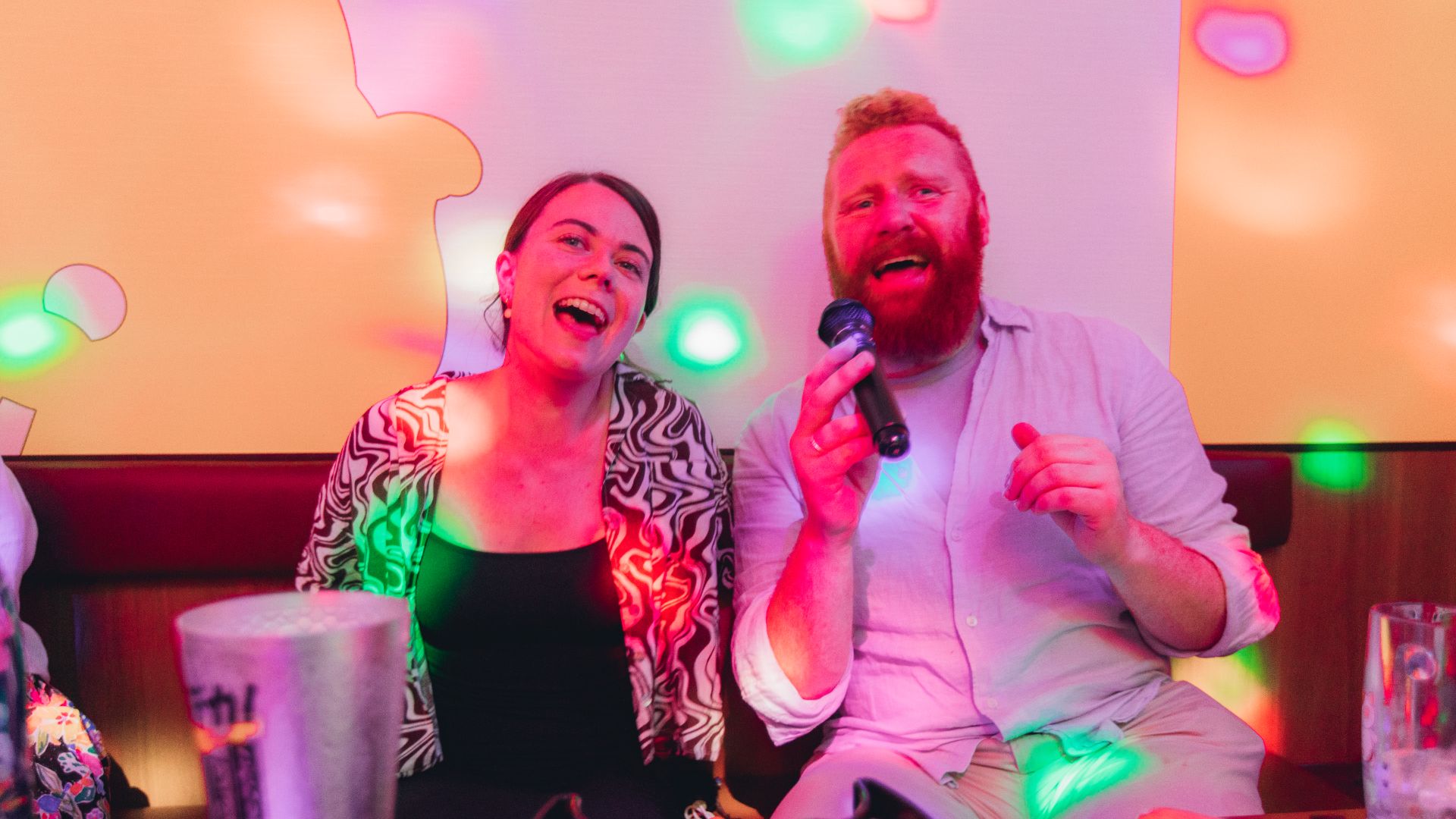 Travellers trying karaoke in Japan.