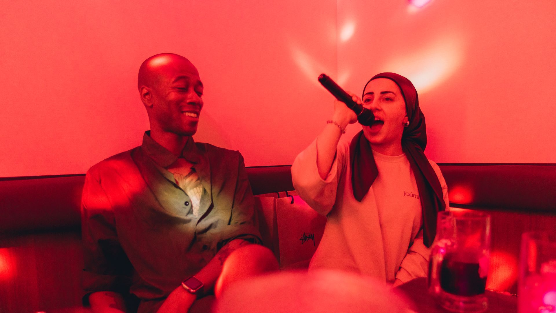 Intrepid travellers in Japan doing karaoke.