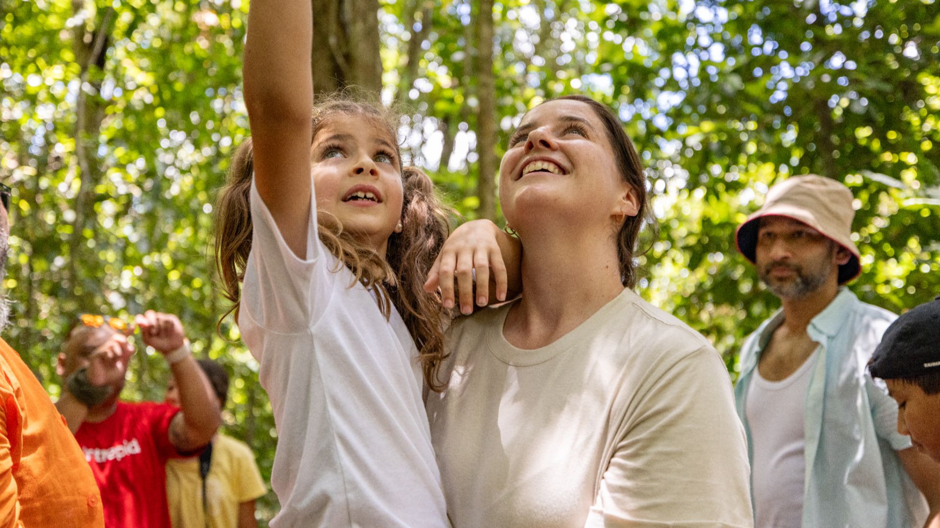 A family admiring Borneo's nature with Intrepid.