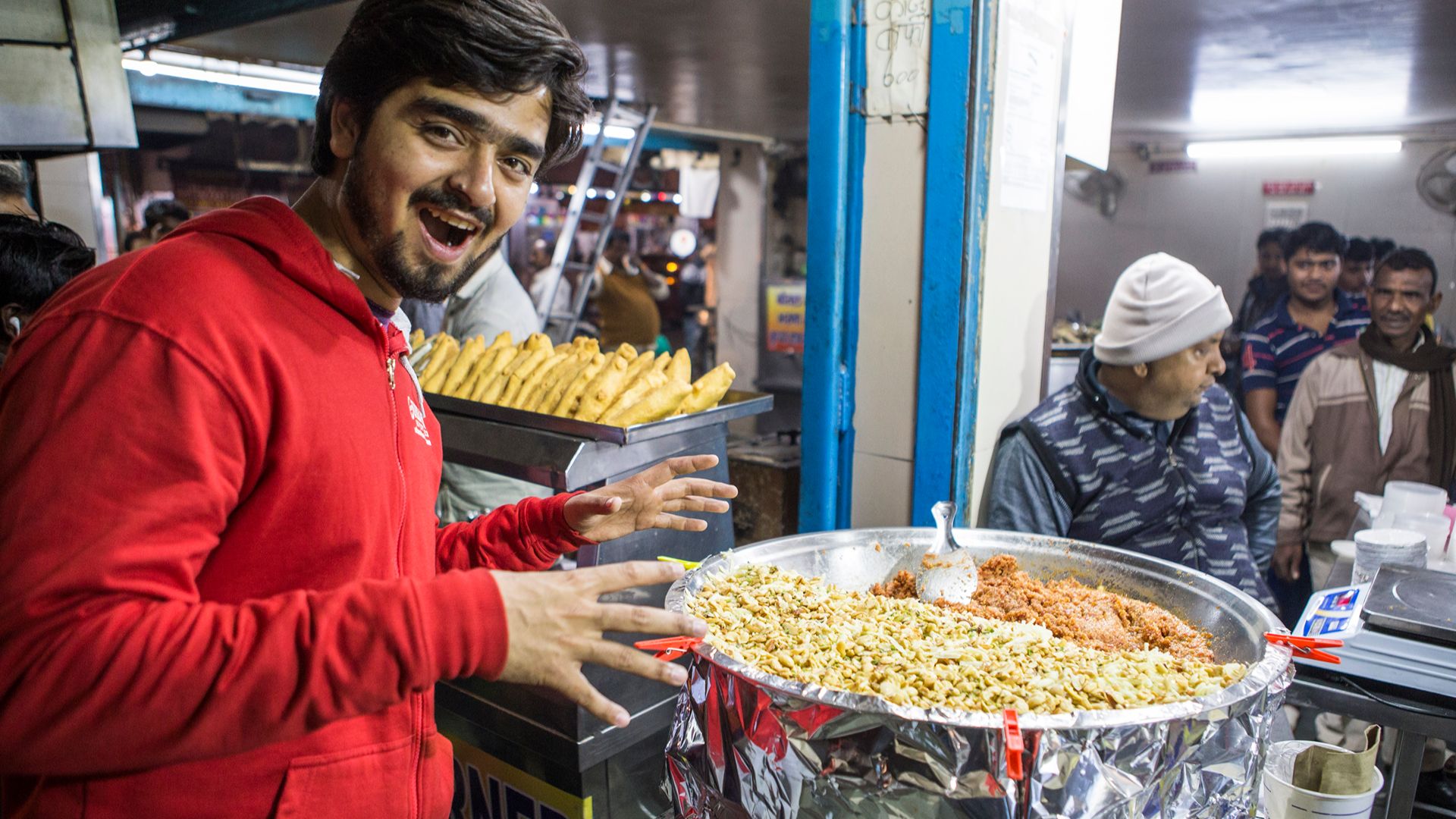Street food dishes being cooked in Delhi, India.
