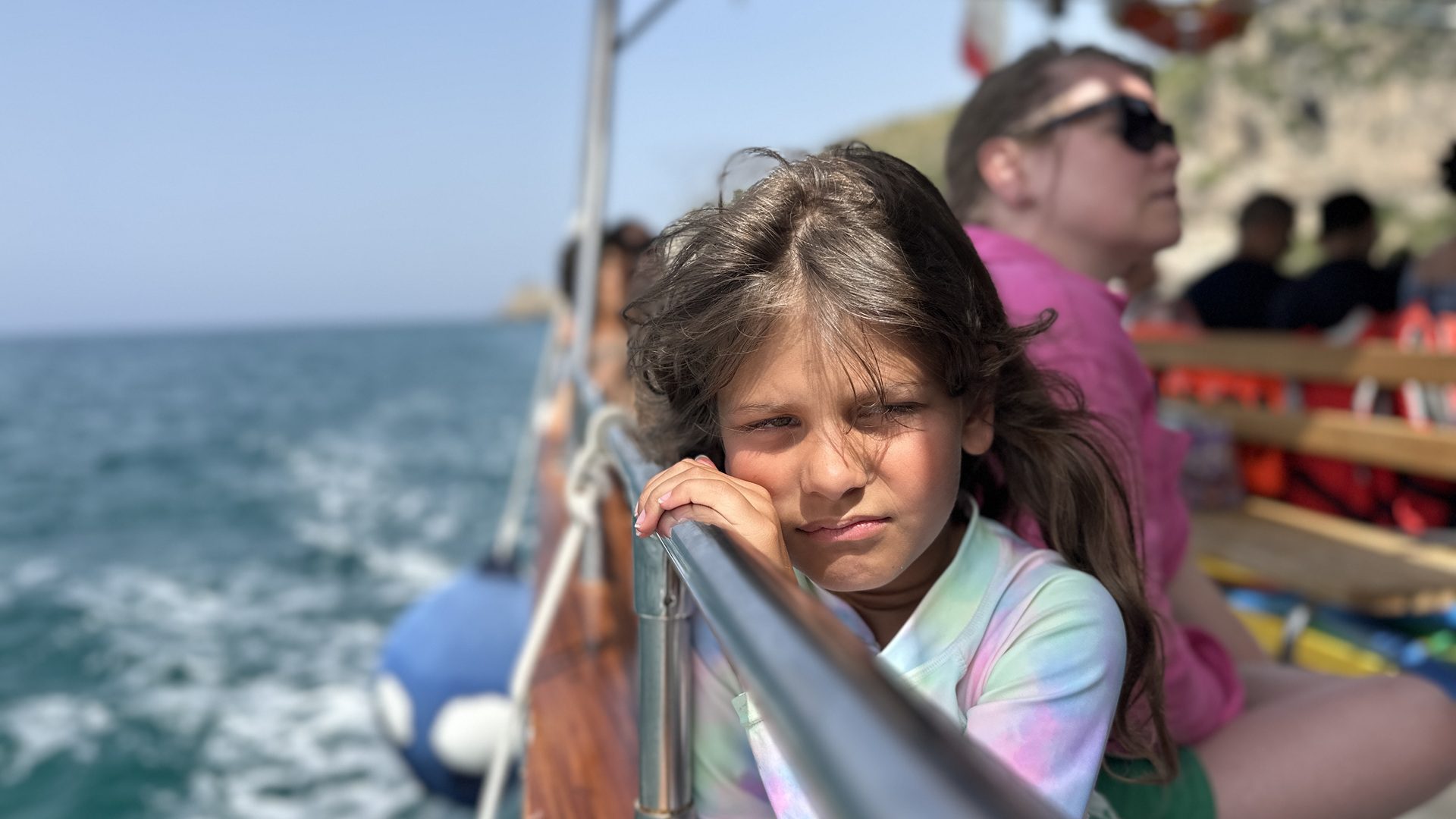 Noa looking sad on a boat in Italy.