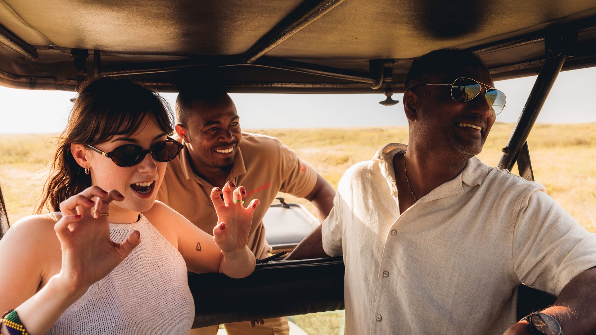 An Intrepid traveller laughing in Tanzania, Africa.