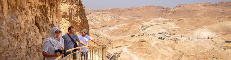 Travellers enjoying the view over the Masada Valley in Israel