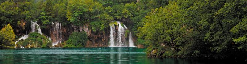 Beautiful waterfall surrounded by forest in Plitvice National Park, Croatia