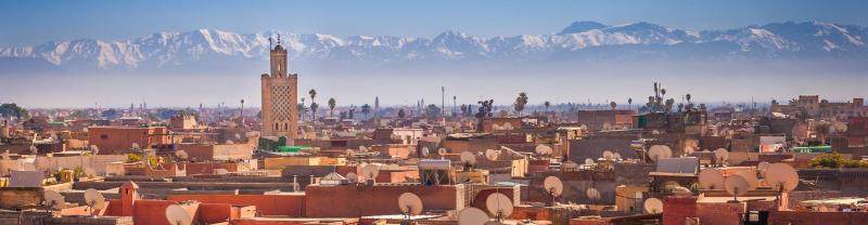 XMPHC - Skyline view of Marrakech with Atlas mountains in background