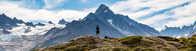 Hiker admiring Mont Blanc mountain range, France