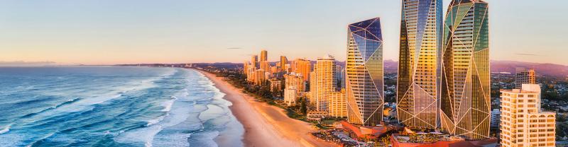 The city skyline on the shores of the Gold Coast at sunset. 