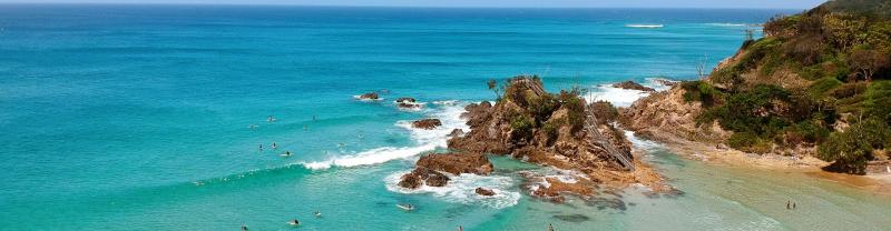 Turquoise waters and rocky cliff at Byron Bay, Australia