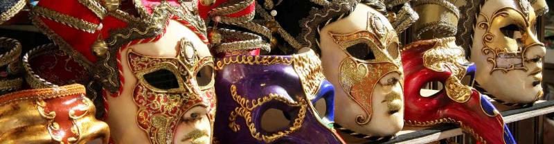 Venetian masks at festival stall in Italy