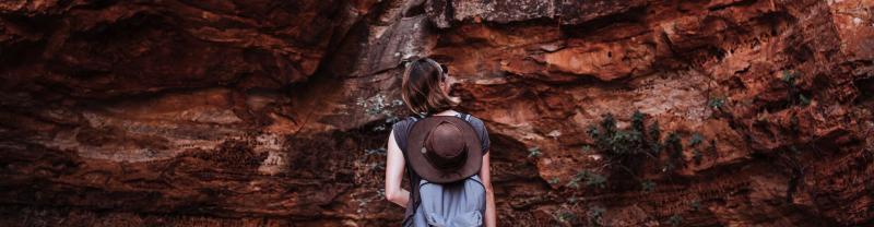 A traveller hiking through a rocky gorge in the Kimberly, Australia