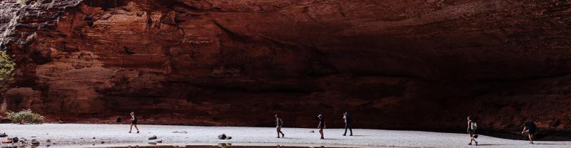 A group of travellers hiking in Purnululu National Park, Western Australia