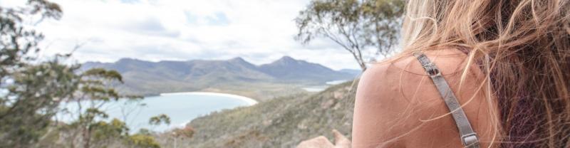 A woman admiring the view of Wineglass Bay