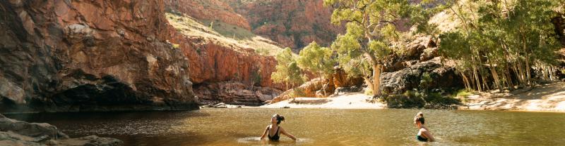Two travellers swimming in Ormiston Gorge in West MacDonnell National Park