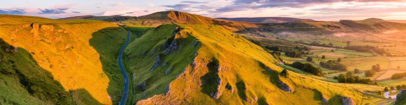 The green hills of England's peak district during golden hour 