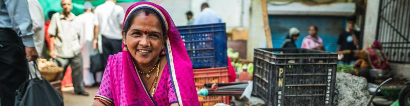 A local women sitting down at a market in Udaipur