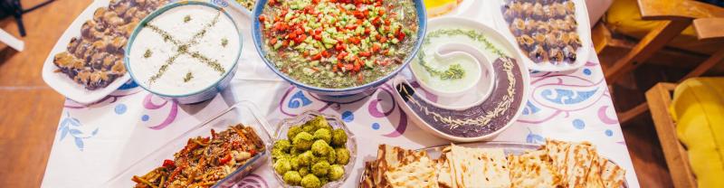 A spread of Iranian food at a local's home in Shiraz, Iran