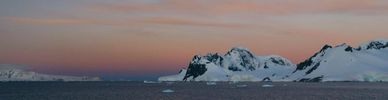 Floating ice shelves in Antarctica as the sun sets