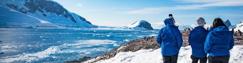 Intrepid travellers admiring the views in Antarctica