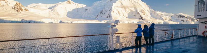 Travellers standing on the deck on an Antarctica cruise ship
