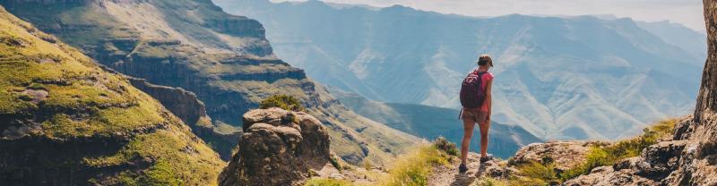 A hiker admiring the views in the Drakensberg, South Africa