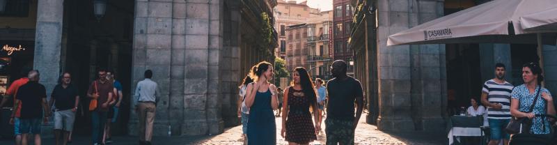 A group of travelers walking through the streets of Madrid