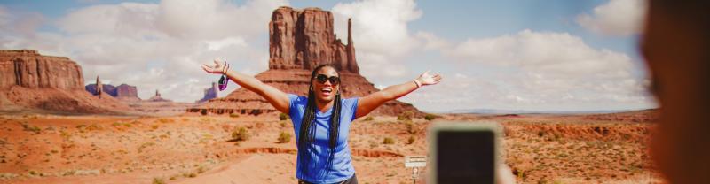 A traveller posing for a photo in Monument Valley, Arizona 