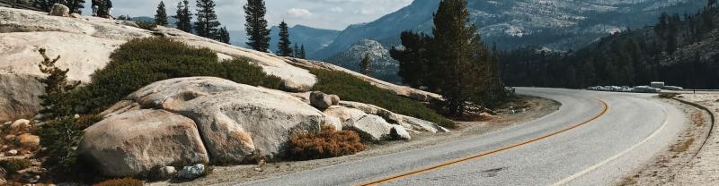 An empty winding road through Yosemite National Park
