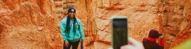 A traveller posing for a photo in Bryce Canyon National Park, Utah