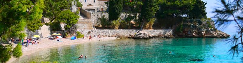 Beachgoers swimming in the sea on Hvar in Croatia