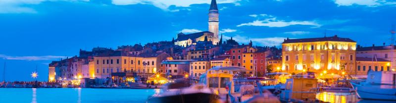 A scenic view of Rovinj in Croatia lit up at night