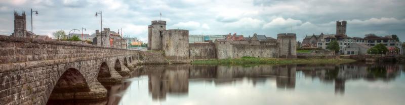 King John's Castle on the banks of the river in Limerick, Ireland on an overcast day. 