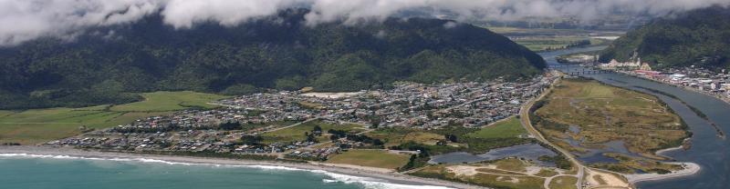 Aerial view of the town of Greymouth, perched on the coastline of New Zealand