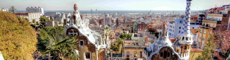 The famously whimsical Park Guell in front of Barcelona's eclectic skyline
