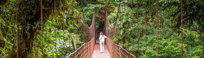 Walking across a suspended bridge in Costa Rica