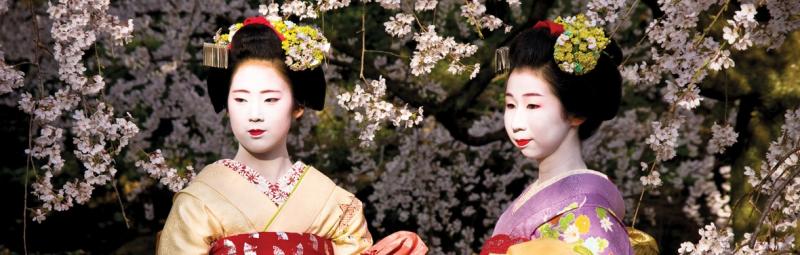 Two Japanese Geisha's posing for a photo in Kyoto