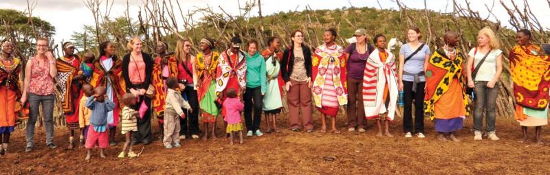 group of travellers with masai mara in Kenya