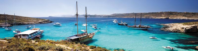 Boats harboured in the Blue Lagoon, Malta