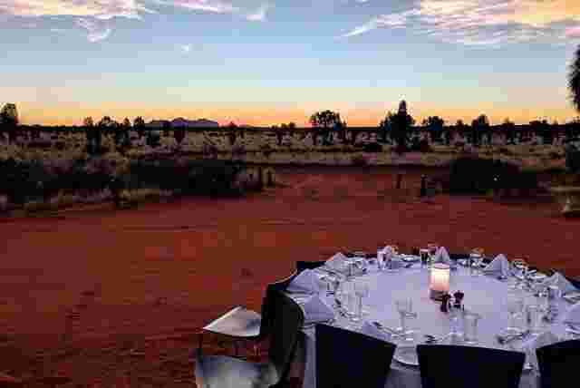 A perfectly made up dinner table in the red dirt of the Outback