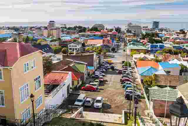 The colourful buildings of Punta Arenas with the ocean in the background